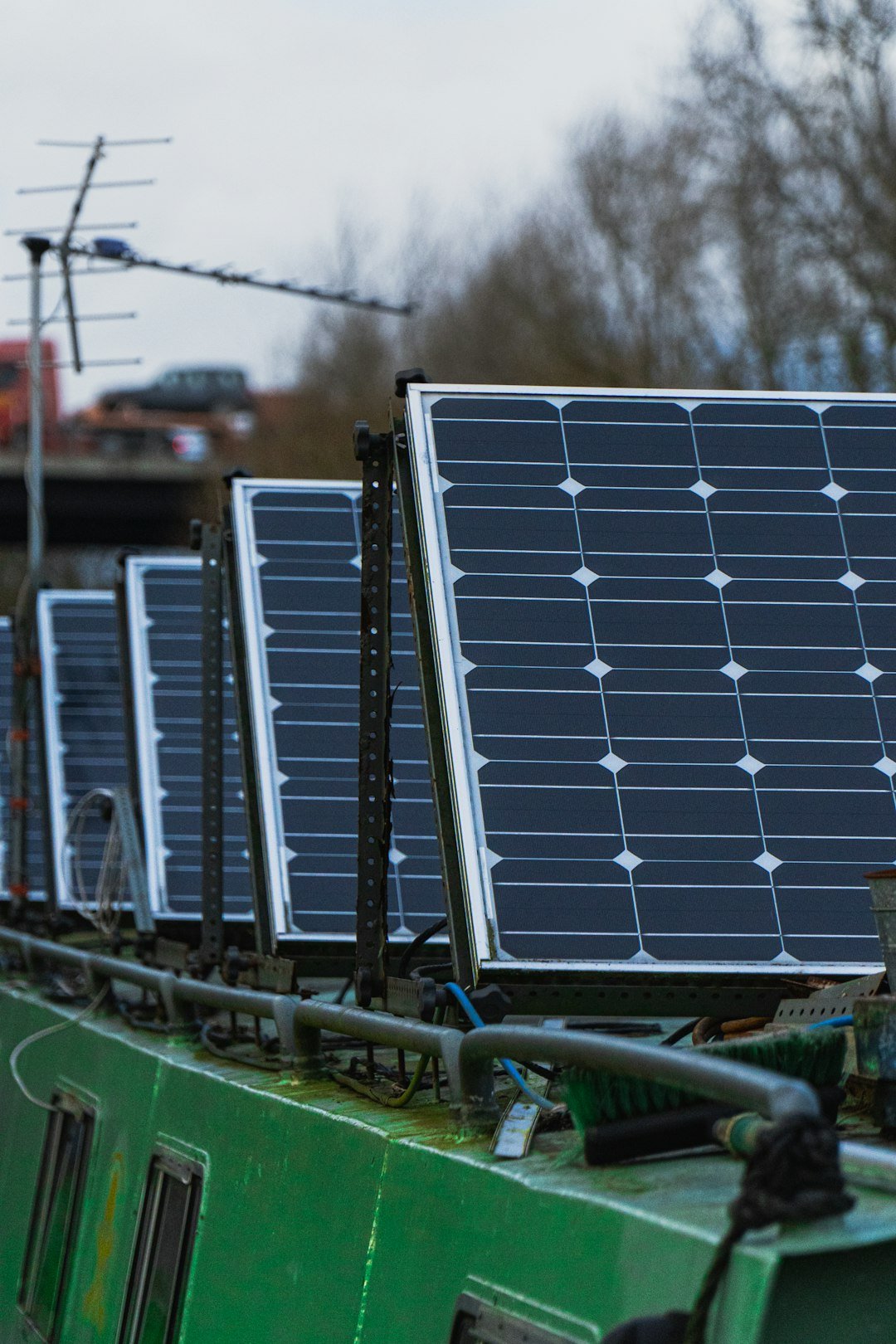 blue-solar-panels-on-green-metal-frame-7h-wbydlpvk